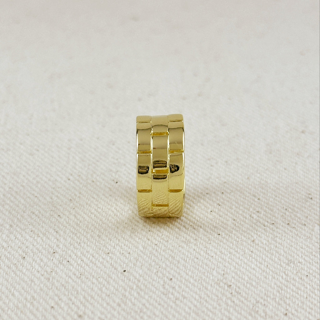 Gold ring on a textured beige background