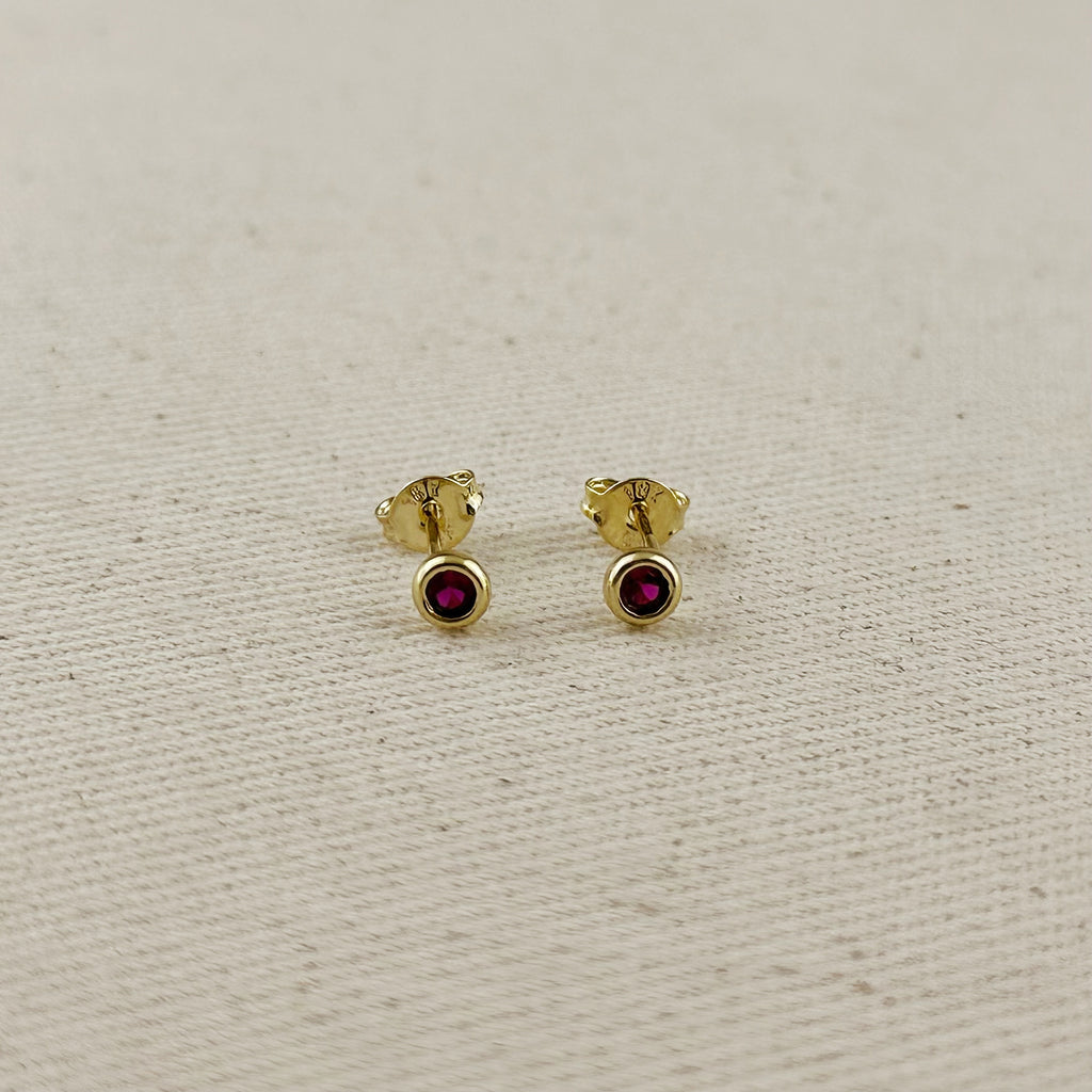 18K gold filled dainty bezel CZ birthstone stud earrings featuring ruby-colored cubic zirconia.