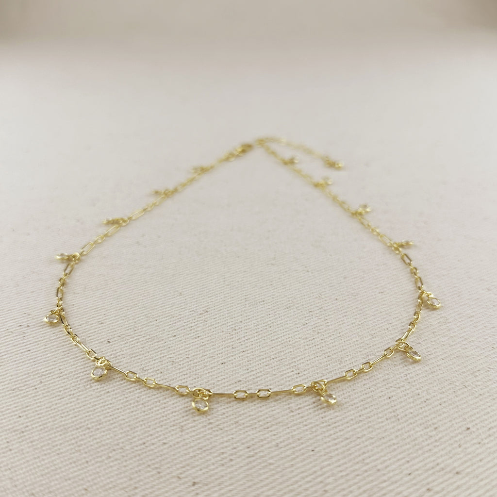 18K gold filled paperclip chain necklace with bezel CZ drops, showcasing modern geometric elegance.