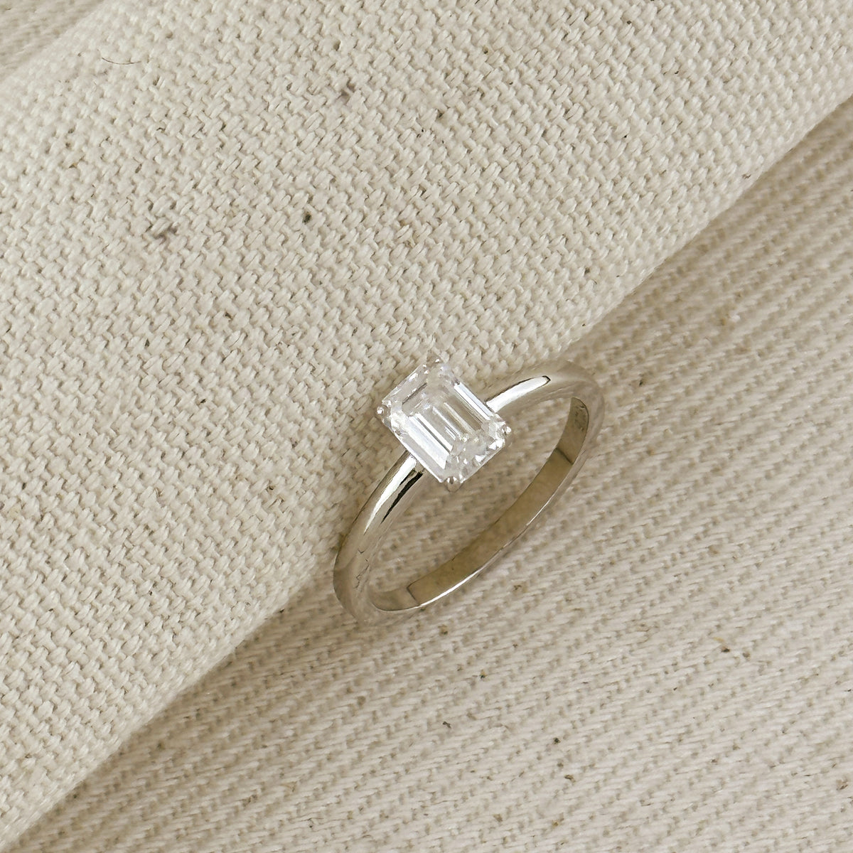 .925 Sterling Silver Rhodium Plated Moissanite Emerald Cut Solitaire Ring