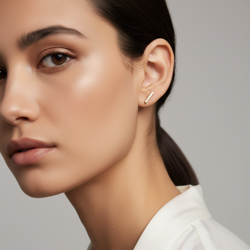 Close-up of a woman wearing a white blazer against a gray background