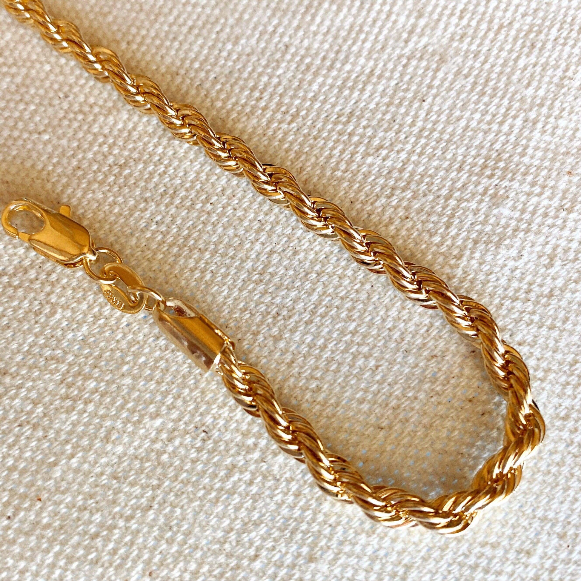 https://goldfi.com/cdn/shop/products/18k-Gold-Filled-4mm-Rope-Bracelet-5.jpg?v=1658332066&width=1946