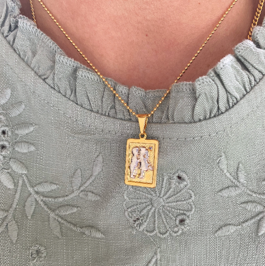 GoldFi 18k Gold Filled Plate Rectangle Pendant Featuring A Boy And Girl Kiss in Rhodium Detail Little Cubic Zirconia
